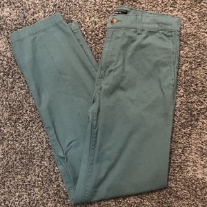 Light forest colored wide legged cargo pants for men